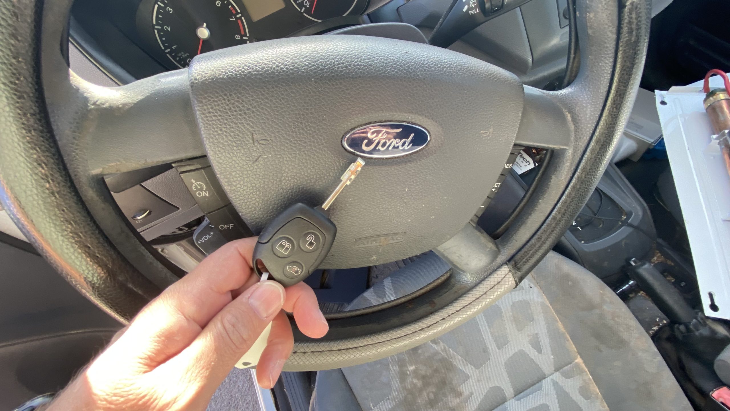 car key cutting machine with metal shavings everywhere